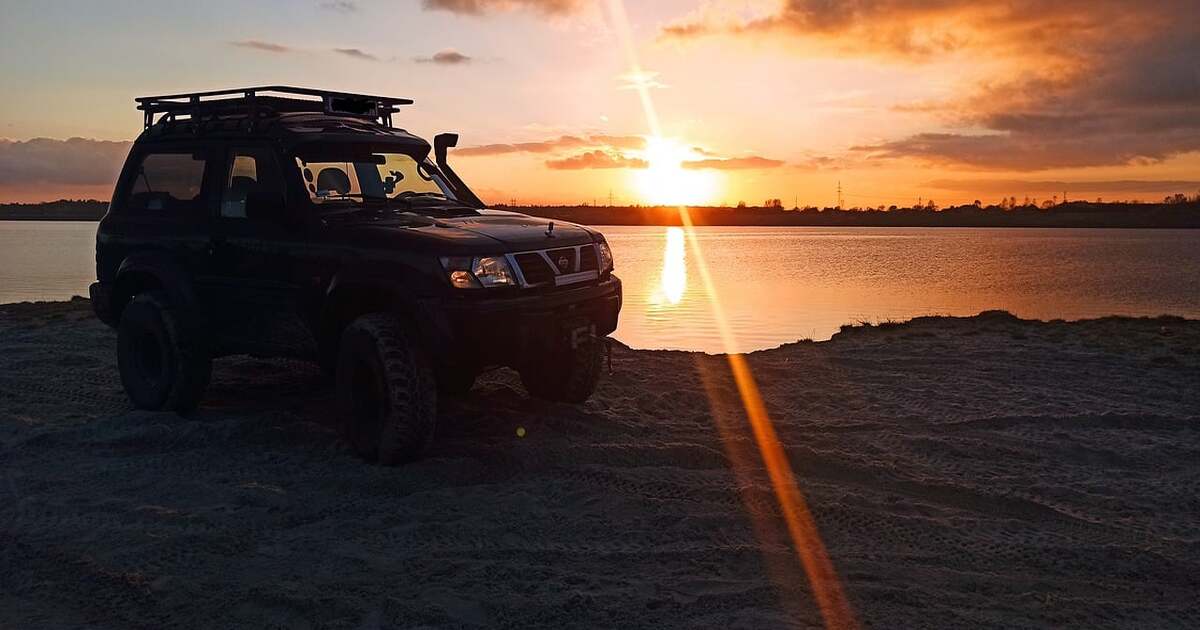 A Nissan Patrol with some of the best Y62 mods available out in the desert.